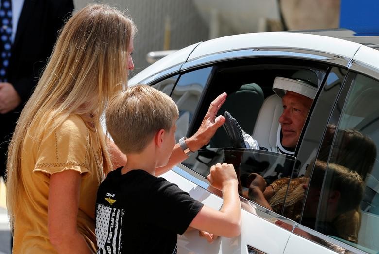 NASA astronaut Douglas Hurley's wife Karen Nyberg and their son say goodbye before the launch of the SpaceX Falcon 9 rocket and Crew Dragon spacecraft at the Kennedy Space Center, in Cape Canaveral, Florida. REUTERS/Joe Skipper  